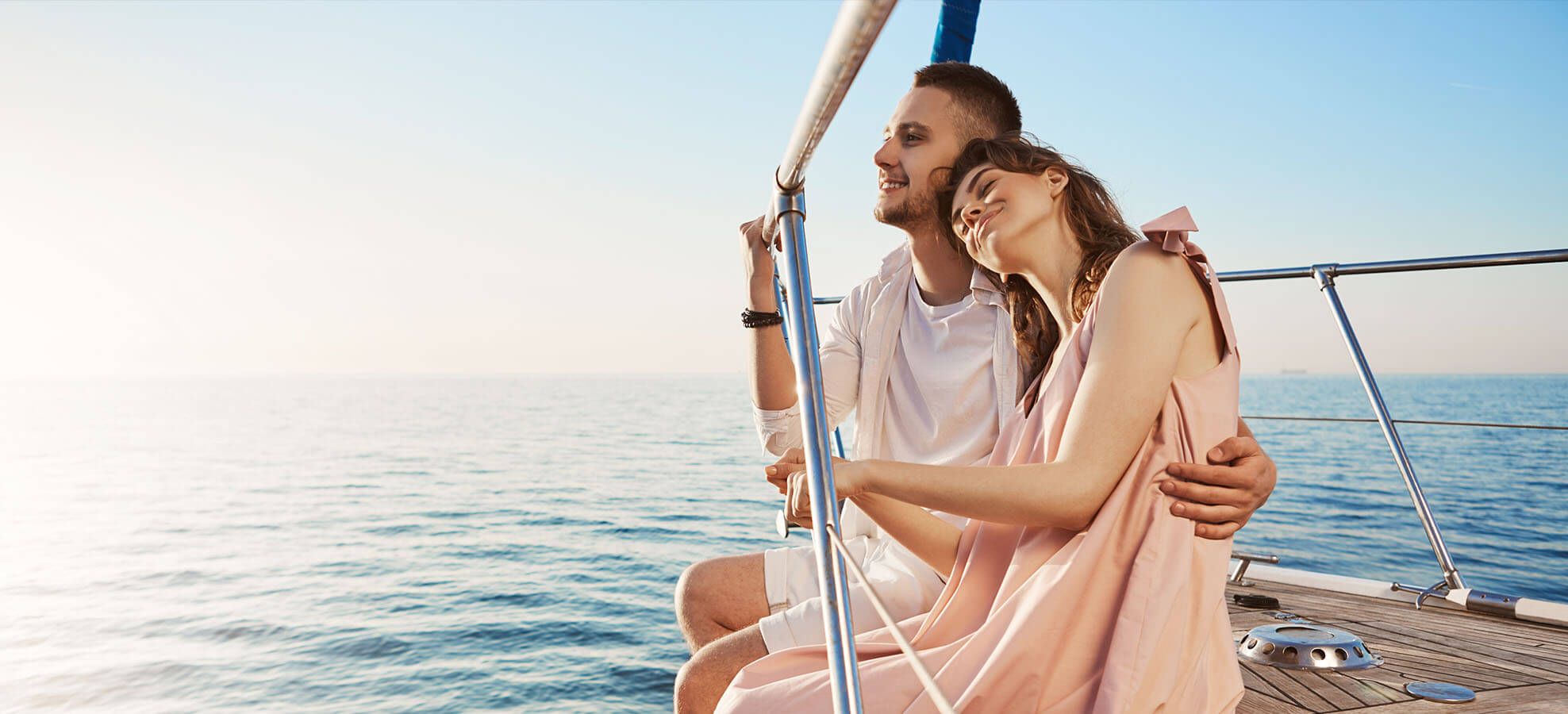 Happy couple sailing away