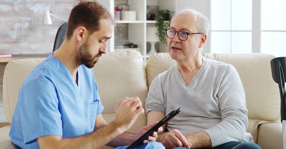 Elderly man receiving a diagnosis