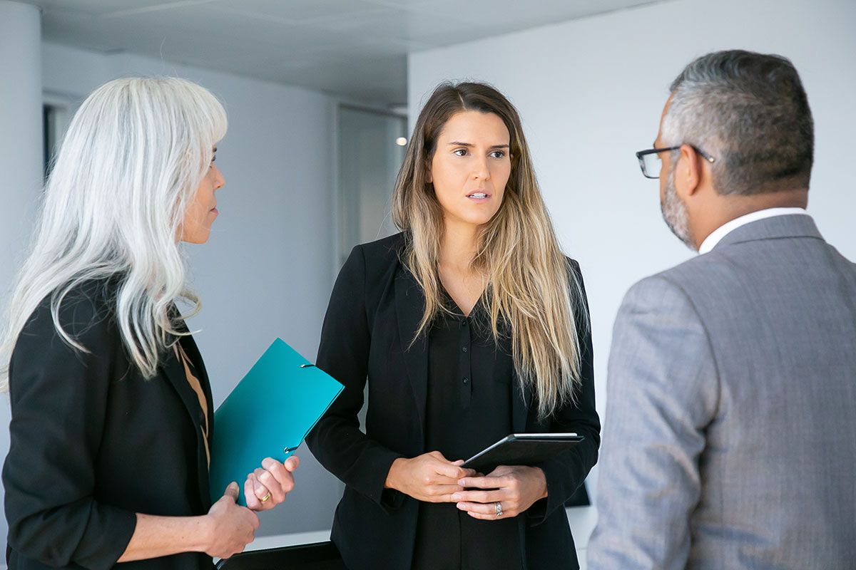 serious worried female manager with tablet