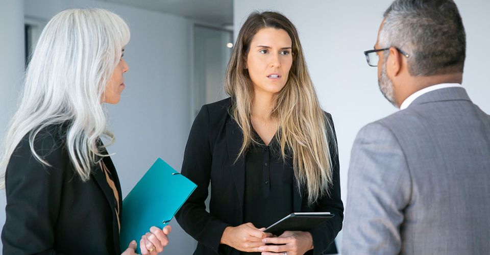 serious worried female manager with tablet